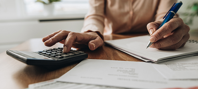 photo - woman using calculator