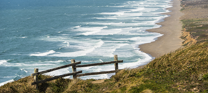 photo - Wooden Fence on a Cliff by the Pacific Ocean