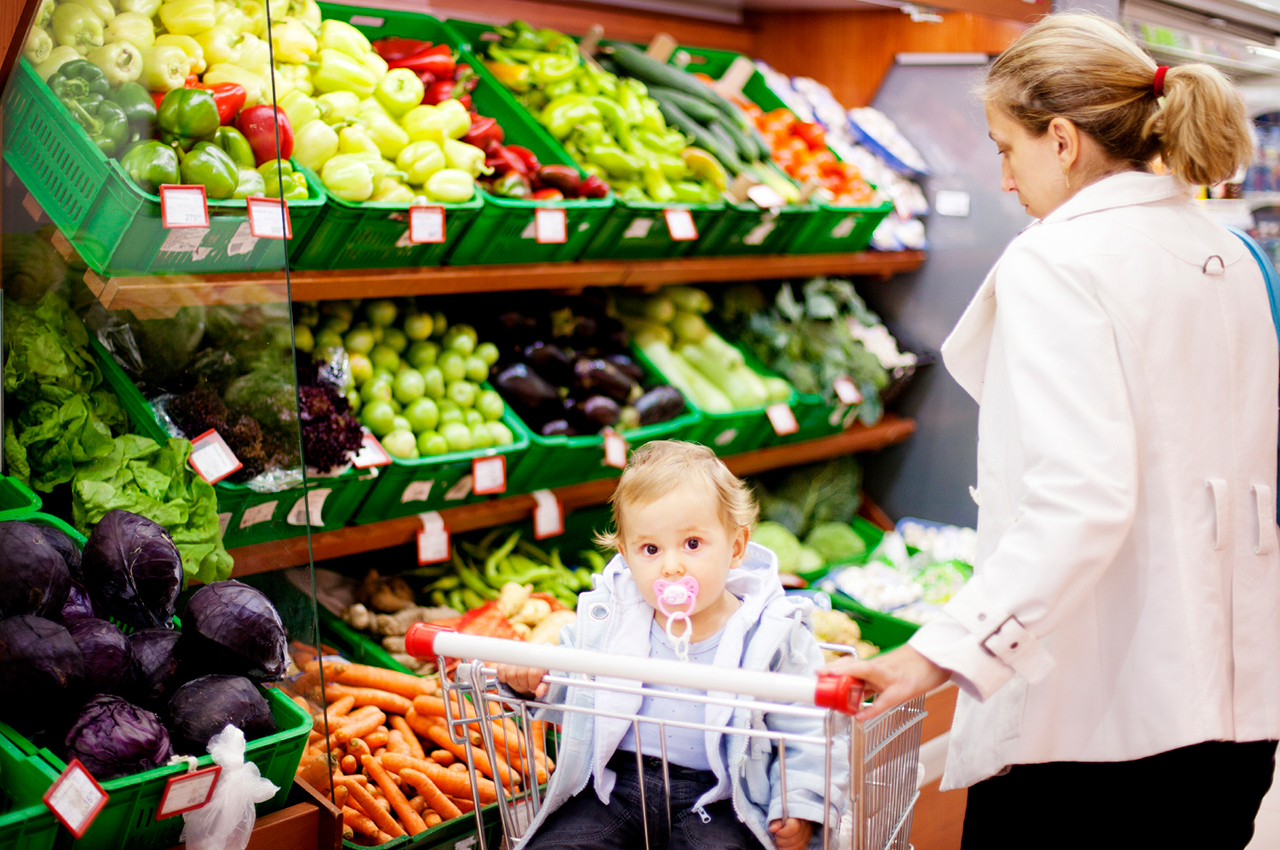 Photo of mother and baby grocery shopping